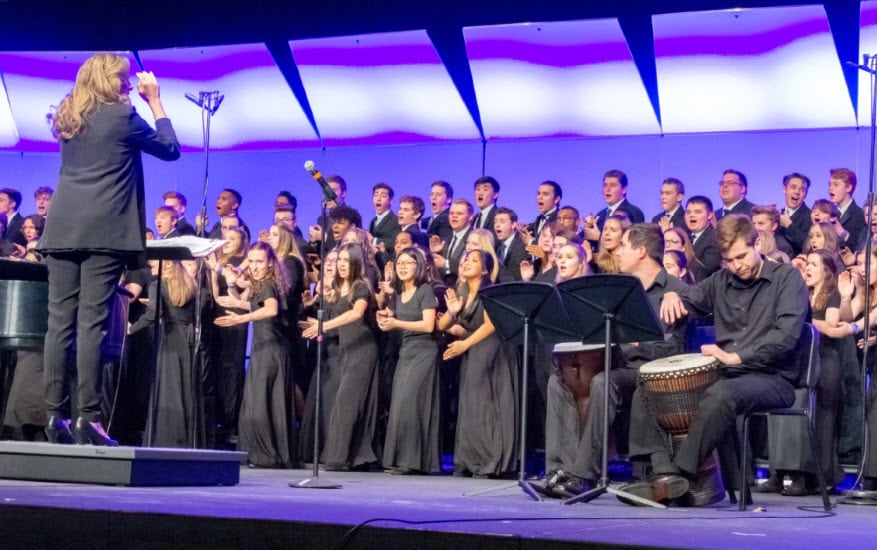 2018 All-National Honor Ensembles mixed choir performing on stage under the direction of Dr. Amanda Quist