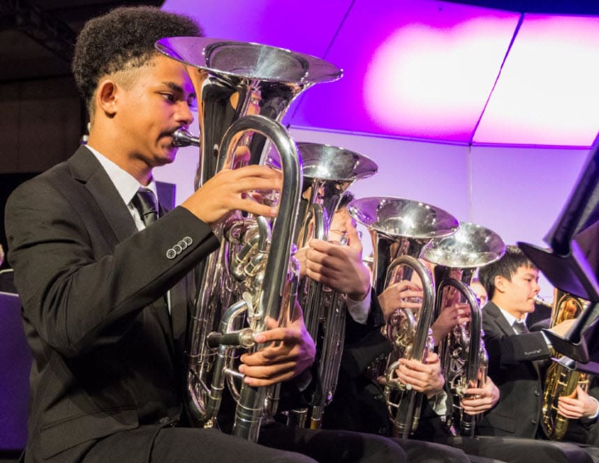 All-National Honor Ensembles Concert Band brass performers on stage