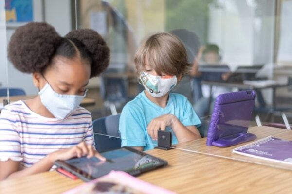 Elementary classmates working on assignment together
