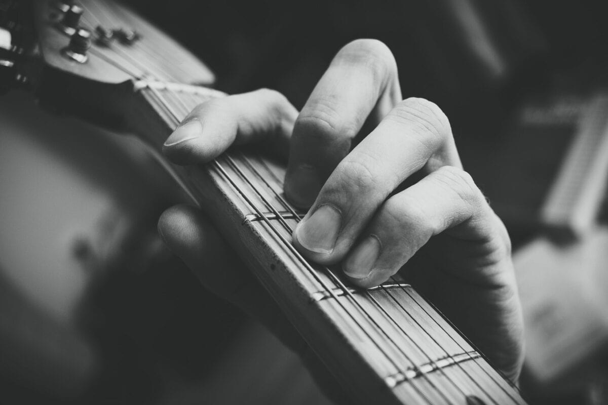 closeup shot of a hand practicing guitar