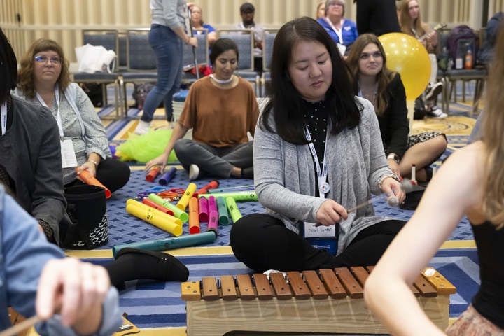 teachers in general session with elementary music instruments