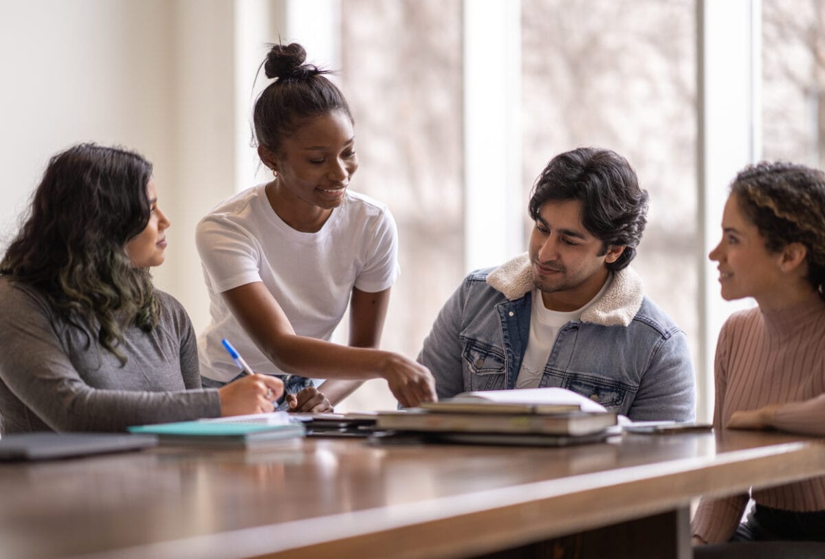 four college students working together