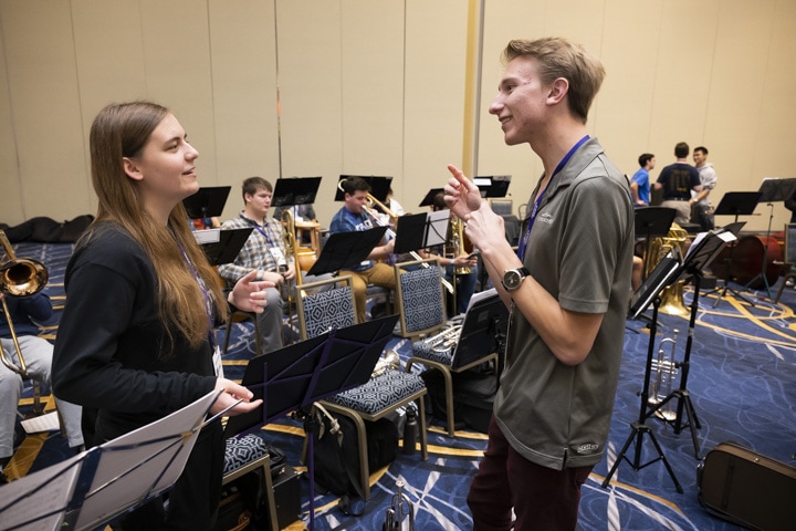 2022 ANHE Concert Band Rehearsal students conversing