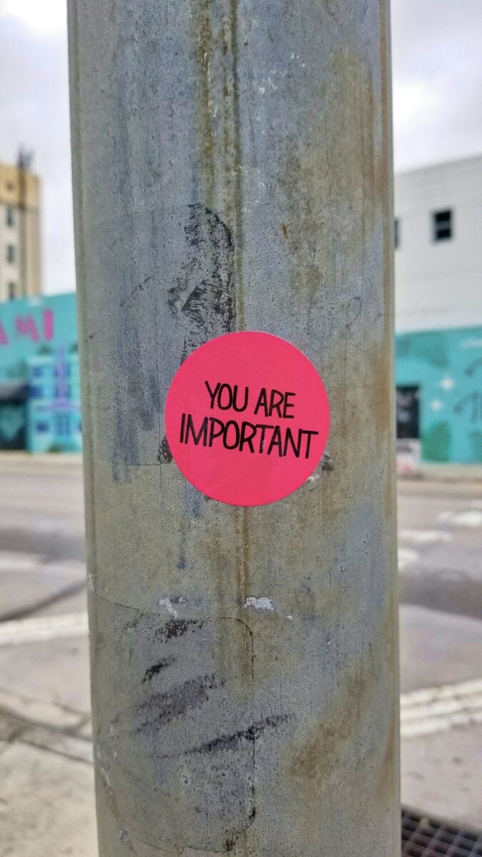 red You Are Important sign on telephone pole