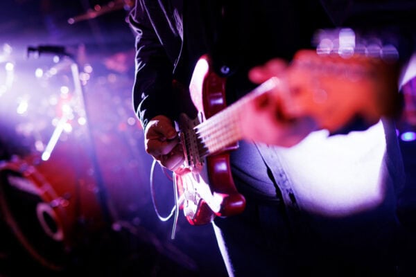closeup of guitarist at concert