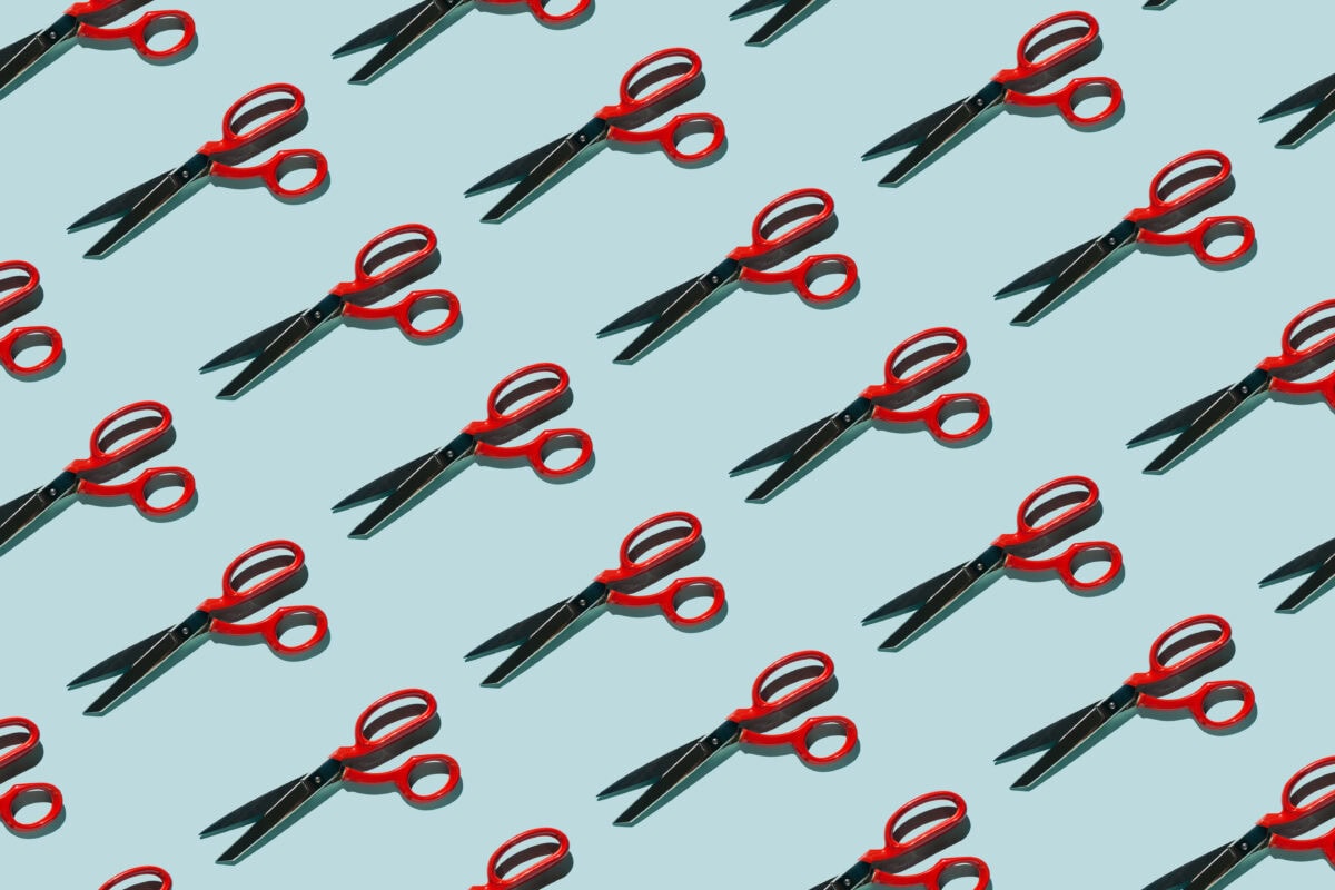 red scissors pattern against light blue background