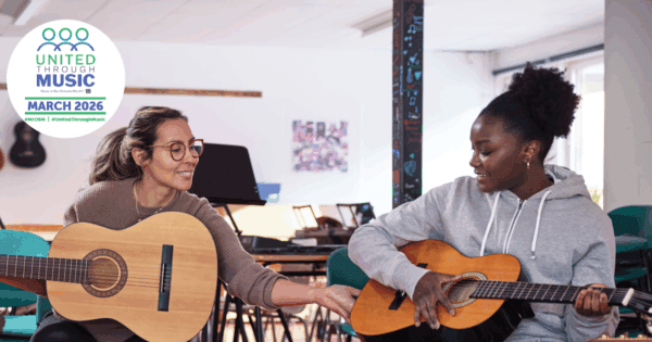 teacher and high school guitar student. Music In Our Schools Month
