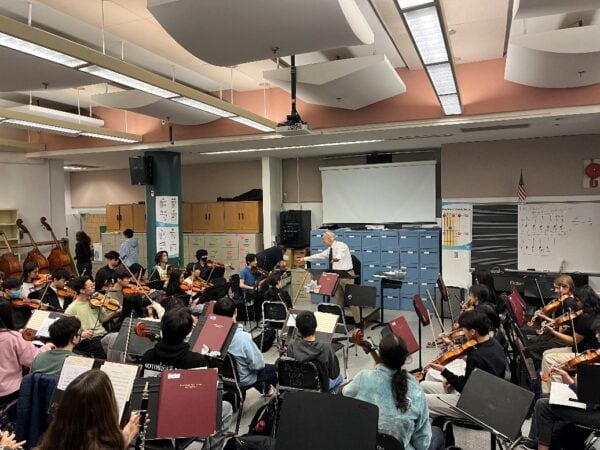 orchestra ensemble classroom with students rehearsing
