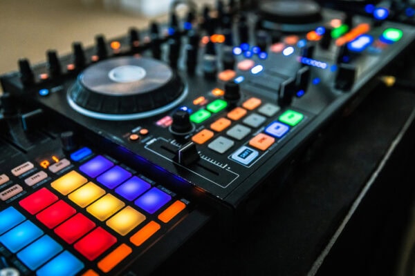 Vibrant DJ Controller With Colorful LED Lights In Action