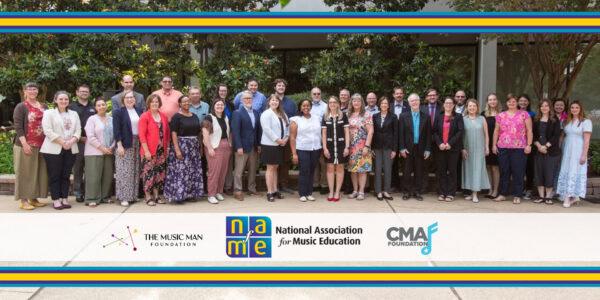 Group photo of the Advocacy Leadership Force standing together in a plaza surrounded by greenery
