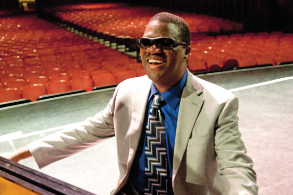 Marcus Roberts smiling at piano on stage