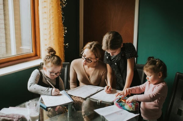 Mother with children working on homework