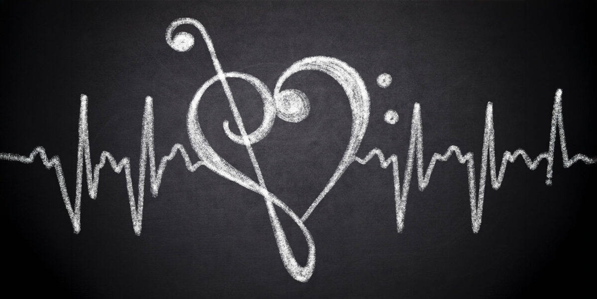 Music clefs in heart shape with cardiogram line