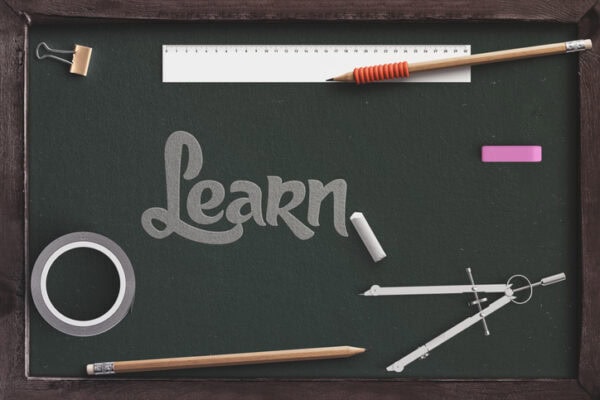 learn text with chalkboard with school supplies