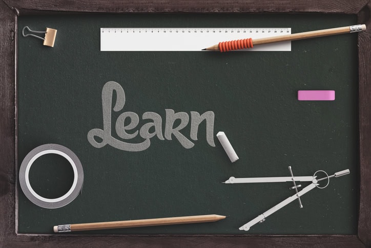 learn text with chalkboard with school supplies