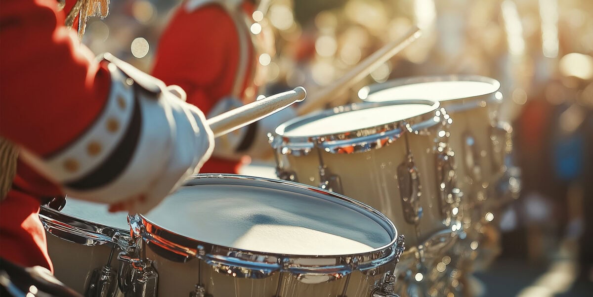 marching band drummers in mid-motion