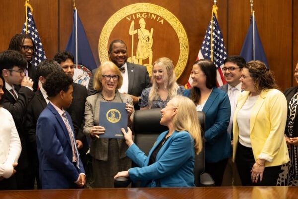 Virginia music students, educators, administrators, and VMEA leadership with Del. Vivian Watts (holding signed HB478) and Governor Abigail Spanberger at the bill signing.