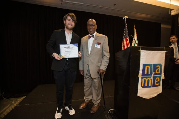 NAfME President Cecil Adderley with Ethan Hacker holding the Shannon Kelly Kane scholarship certificate