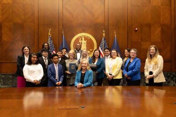 Virginia music educators, students, and music education leaders with Virginia Delegate Vivian Watts and Governor Abigail Spanberger at bill signing.