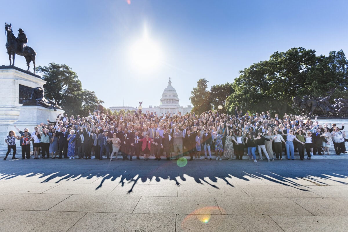 300 music education advocates pose for group shot on U.S. Capitol steps on a sunny day