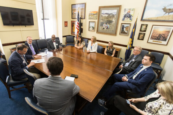 music education advocates around large square table in congressional office meeting with staff