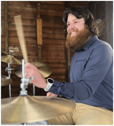 Cameron Siegal playing drums