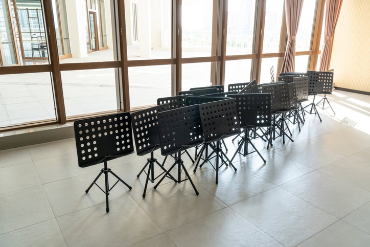 set of music stands in empty classroom
