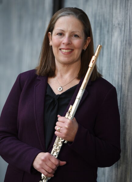 Kathleen Melago headshot holding flute
