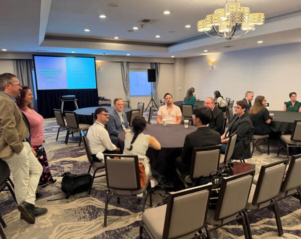 SRME and SMTE organized two well-attended mentoring sessions for emerging researchers and faculty members. Standing on the left are Brian Weidner, SMTE Communications Chair, and Jessica Nápoles, SRME Committee Member.