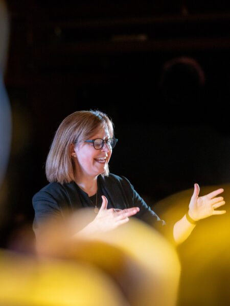Cathy LaFrombois conducting choir