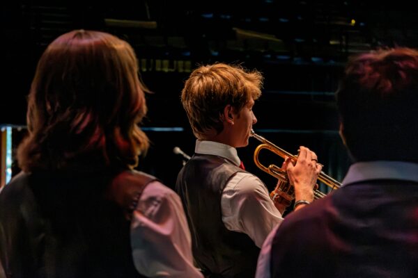 student trumpet musician on stage in concert
